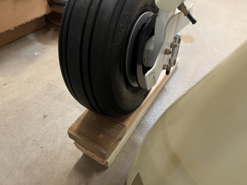 two 2x4's (with wheel chock) for lifting