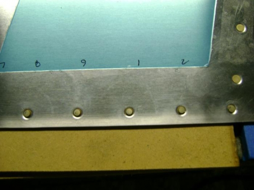 Partially set rivets and numbering