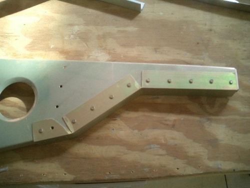 Angle riveted to the rib.  At least as strong as before and possibly even more so now.