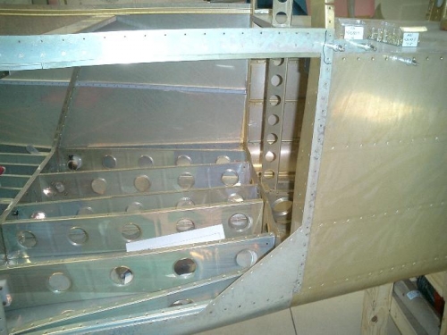 Riveting the left side of tailcone and part of the bottom.