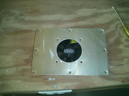 Hole drilled and fan fitted with a screen