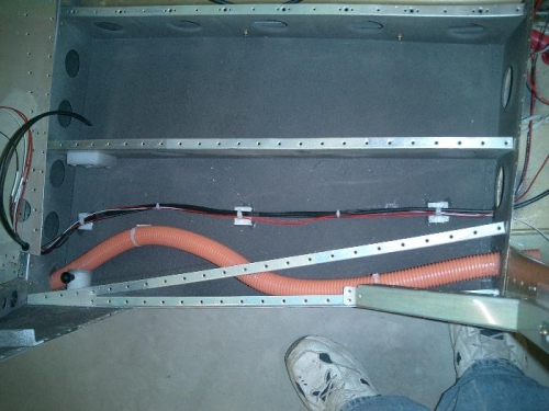 Under baggage floor wiring