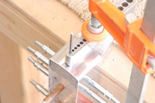 Drilling the pilot hole in the lead counterbalance