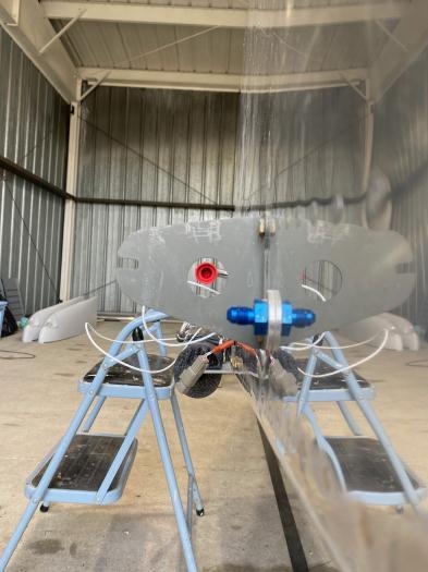 Coming throuh the hole in the flange