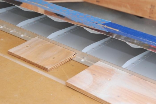 Detail of the hold-down.  L-angle and some scrap plywood