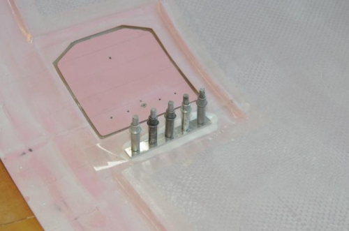 Bonding hinge mount prior to riveting.