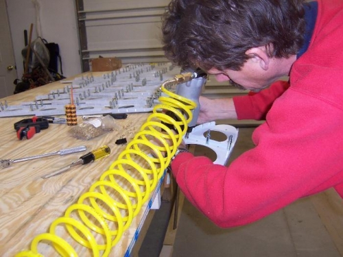 Setting Rivets with Pneumatic Squeezer