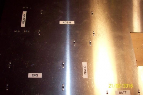 From the top: Mounting holes drilled, nut plates installed, avionics positions labeled.