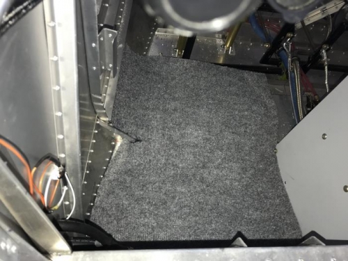 Pilot side cabin floor carpeting test installation.