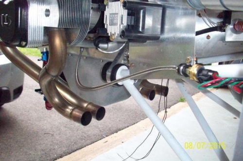 Oil pressure sensor hose runs from a banjo fitting on crankcase  to position on left engine mount.
