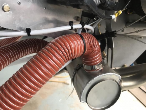 Left heater hose with spacers added.