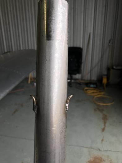 Exhaust pipe with two spring clips welded into place.
