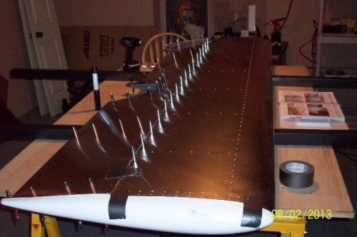 Fiberglass tail tips and tip ribs in place. Elevator is pushed forward onto the hinge.