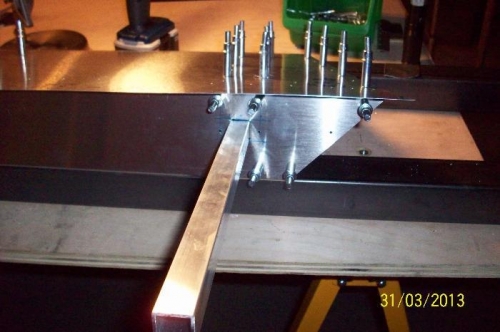 The balance bar extending out the front of the aileron from in between the two new ribs.