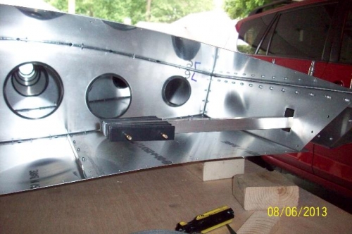 The balance bar with weights attached viewed from inside the wing.