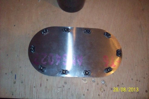 The nut plates, riveted to the inside of the cover.