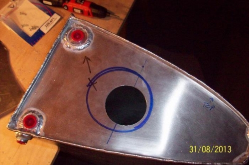 The sender hole cut out of the left tank. Note the rib hole circle (in blue) for orientation.