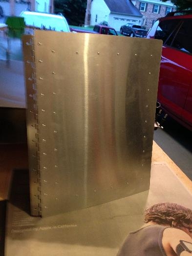 Wing locker cover (door) with hinge riveted in place.