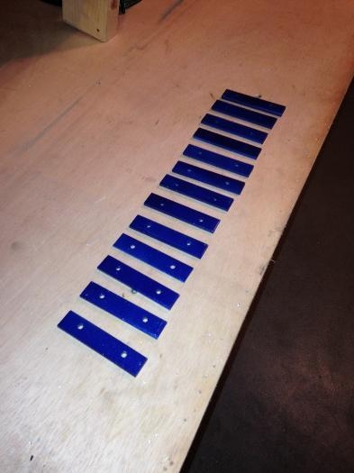 Aileron balance arm weights with their new coat of cobalt blue metal flake.