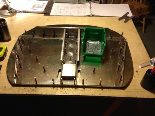 Firewall partially reassembled during riveting. The center siffener rivets all hand pulled.