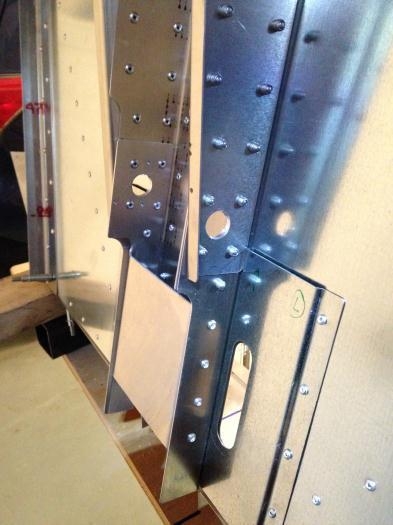 The bungee support holes and steering box slide covers after completion.