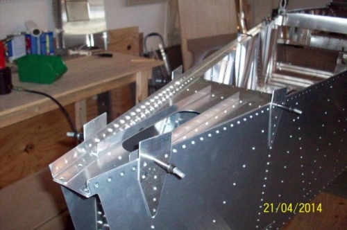 Horizontal tail frame section, including upper rear longerons, all riveted in place.