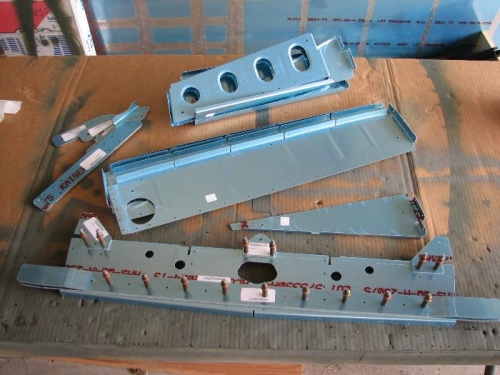 The seat rib sub assembly parts, some clecoed.
