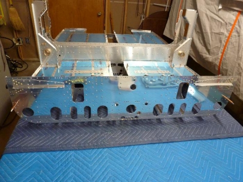 bulkhead rivetted to seat floor
