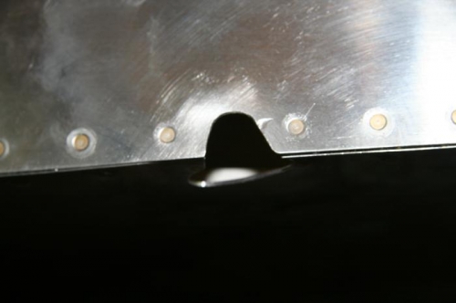 Left wing flap pushrod clearnahce hole
