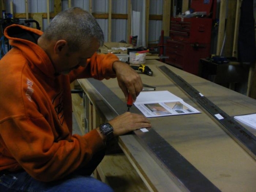 Deburring holes on spars