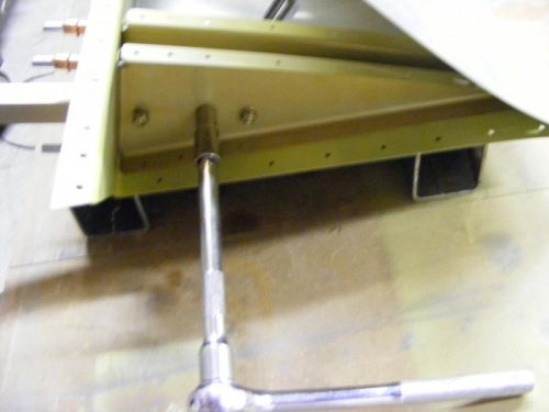 Torque nuts on balance arm