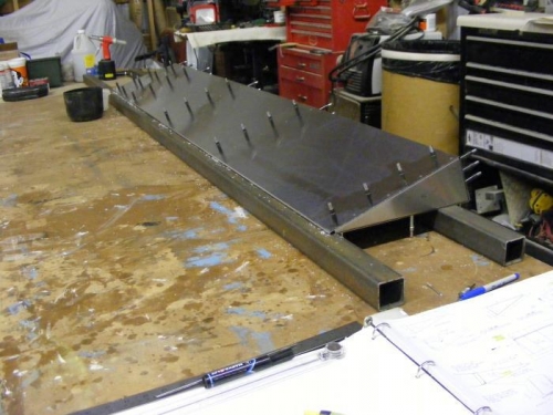 Updrilling of top skin complete