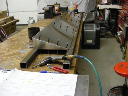 Updrilling of lower skin complete