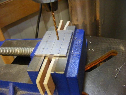 Drilling bell crank pivot brackets