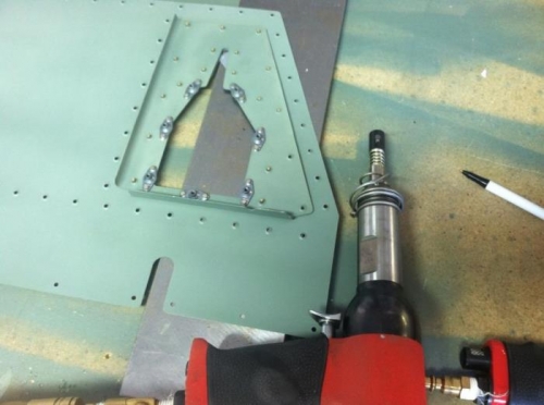 Final riveting the bracket to the elevator bottom skin