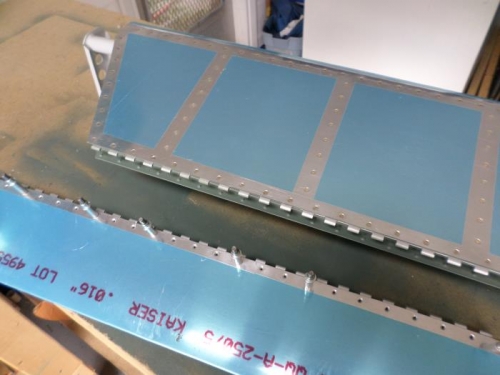 Riveting the pian hinge to the last elevator