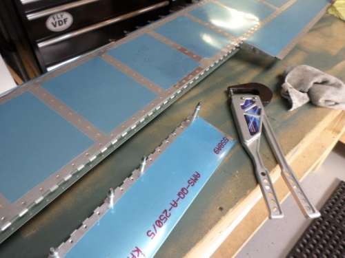 Installing trim tabs to elevator