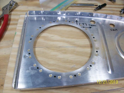 Cover reinforcement ring riveted to rib
