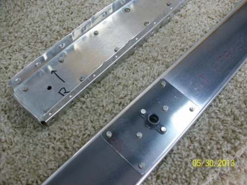 Counterweight and outside rib riveted, ntplates on spar
