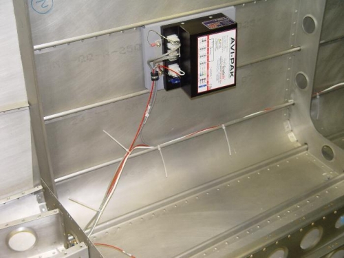 Strobe power supply behind baggage area