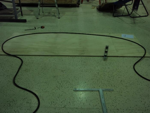 Use heavy extension cord to figure out shape then draw on plywood sides
