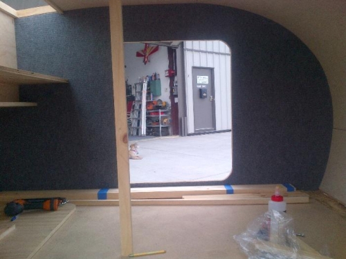 Support holding up ceiling while glue dries, carpet gives a nice finish to the interior.