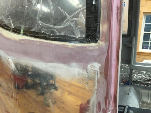 Rear window behind door