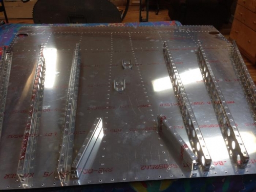 Ribs riveted to fwd floor skin