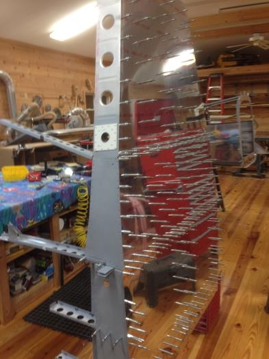 Seat assembly with clecoed skins