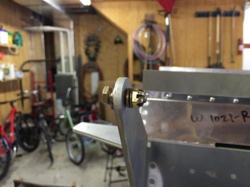 bushings and hardware in flap attach brackets