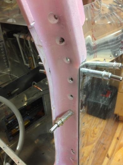 Countersunk holes on sides of cabin door