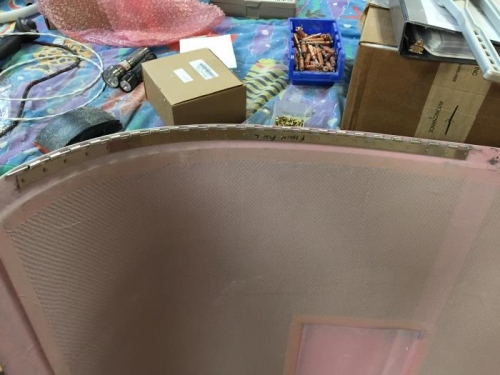 Hinge riveted to upper cowl