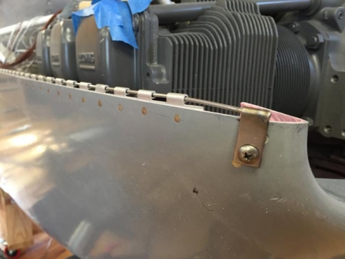 Pin between upper and lower cowl