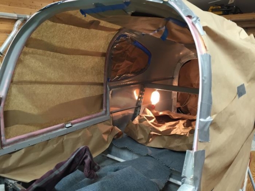 Inside cabin windows taped for painting cabin